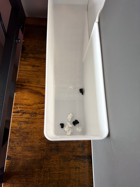 The five "poop" purge blocks generated during the print. Because every single layer required two different colors, the H2C produced this much waste material just to keep the colors clean between transitions — a good baseline for understanding AMS filament consumption on a heavily multicolor model.